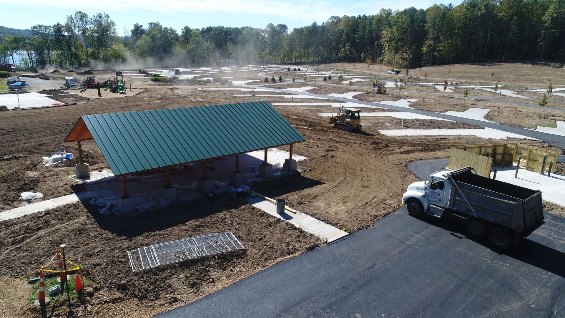 An aerial view of a construction site with a truck in the foreground.