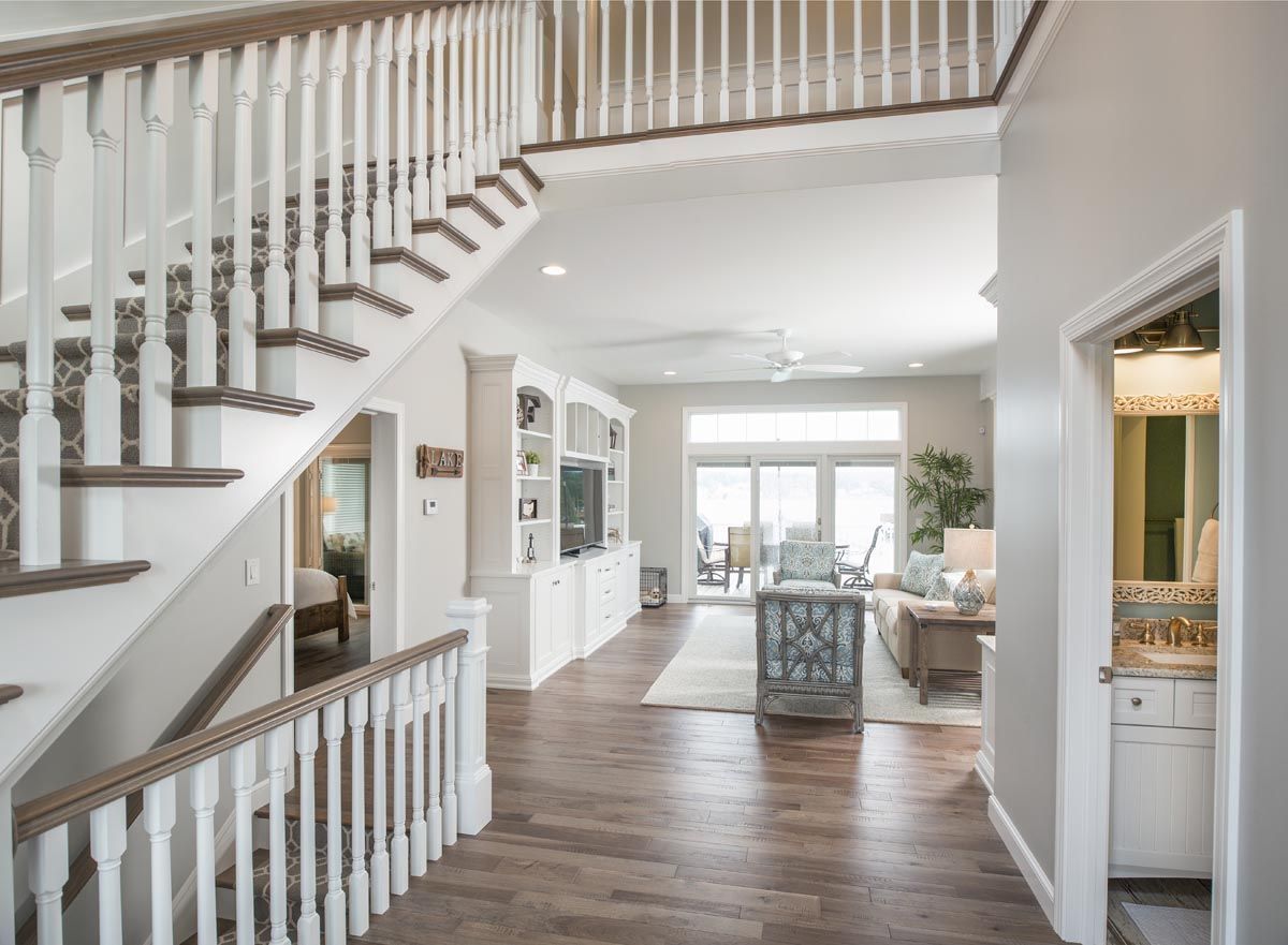 There is a staircase leading up to the second floor of a house.