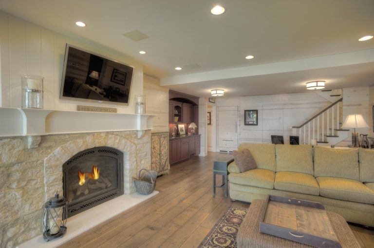 A living room with a fireplace and a couch.