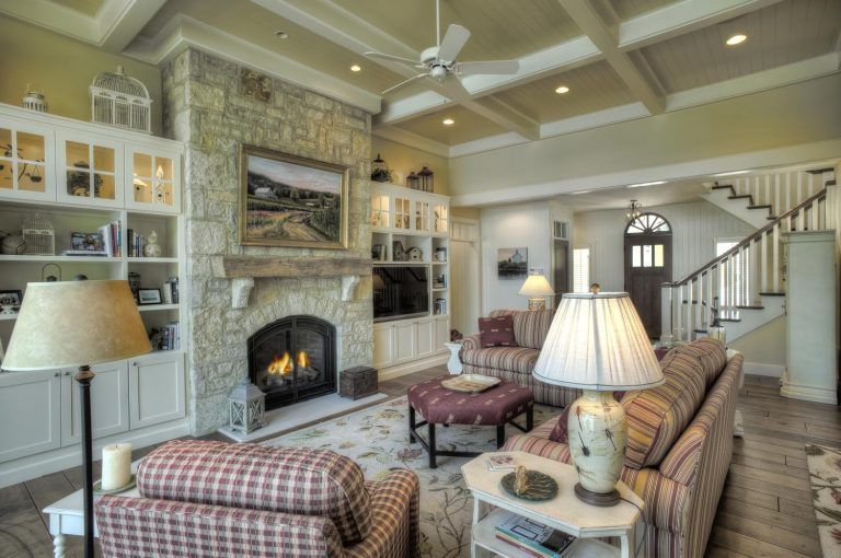 There is a fireplace in the middle of the living room.