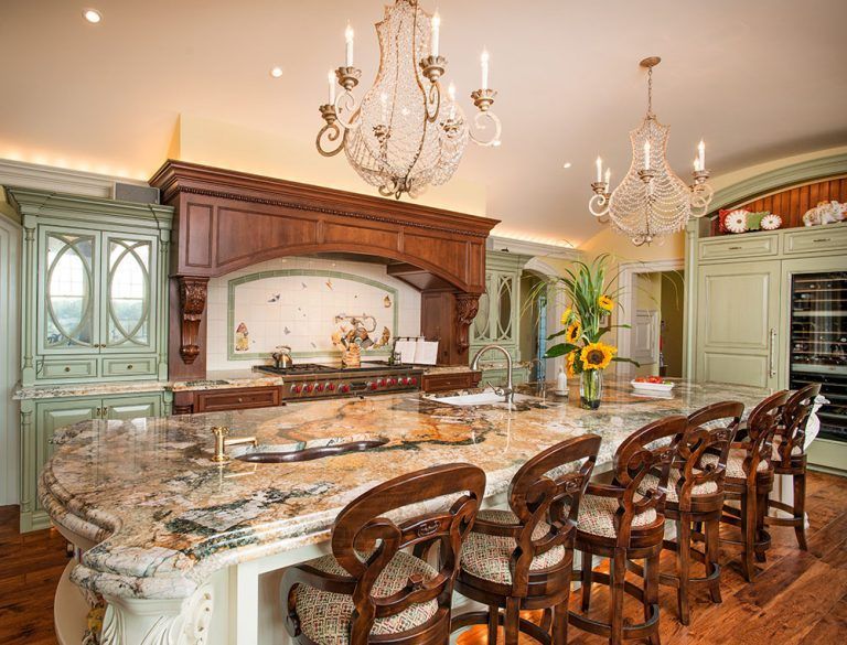 There is a large island in the middle of the kitchen.