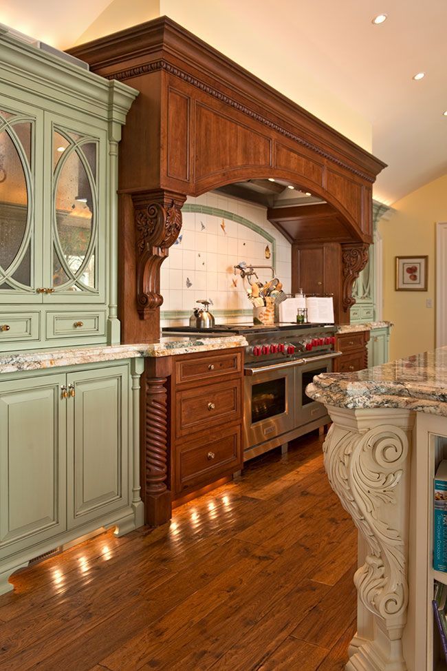 A kitchen with wooden cabinets and a stove top oven.