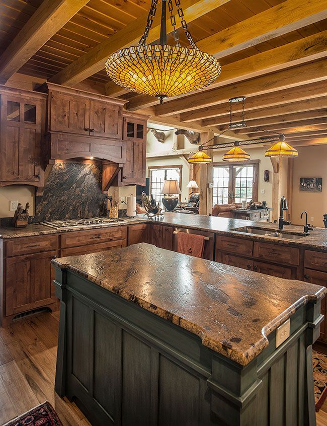 A kitchen with a large island in the middle of it