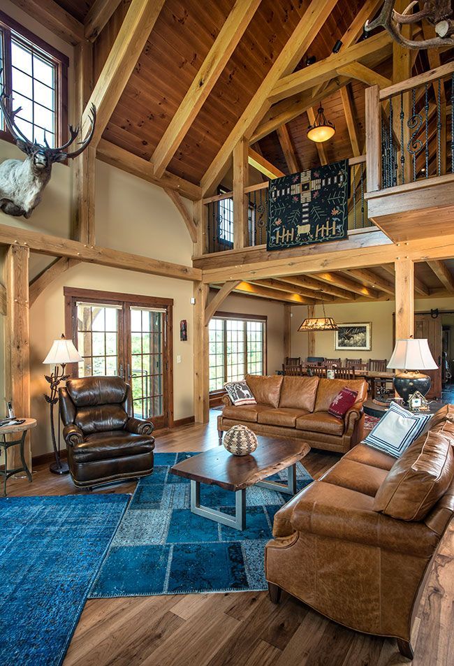 A living room filled with furniture and a wooden ceiling.