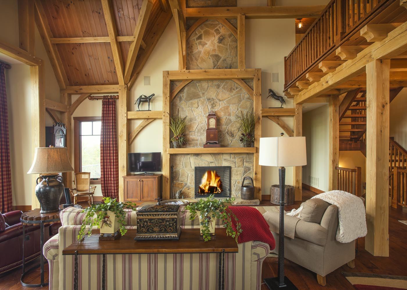 A living room with a fireplace and a clock on the wall.