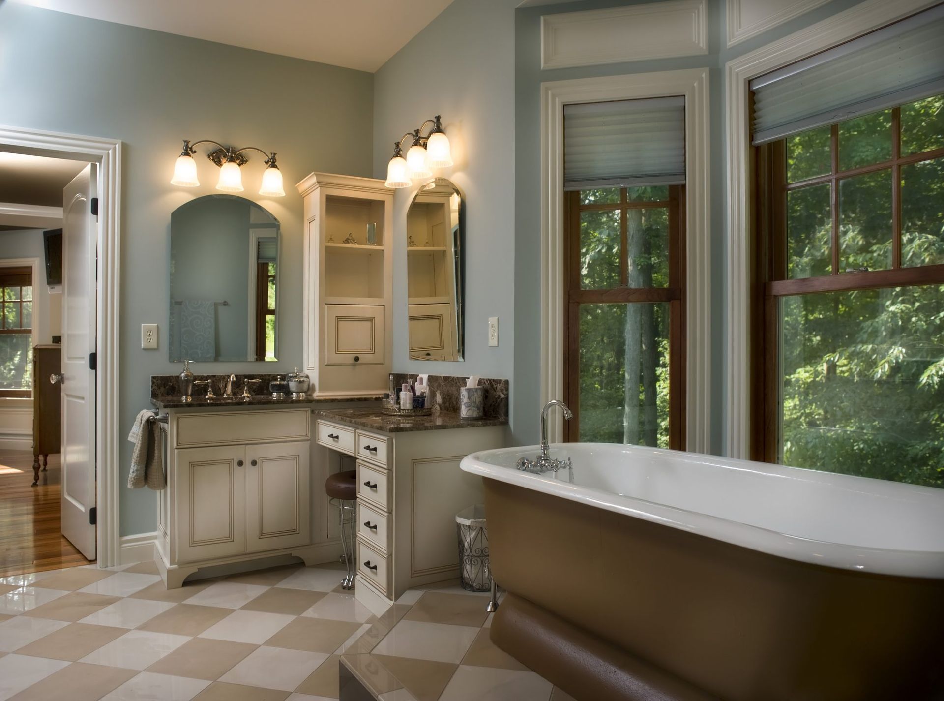 A bathroom with a bathtub and two sinks.