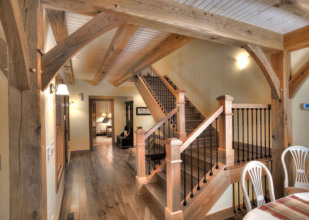 A wooden staircase leading up to the second floor of a house.