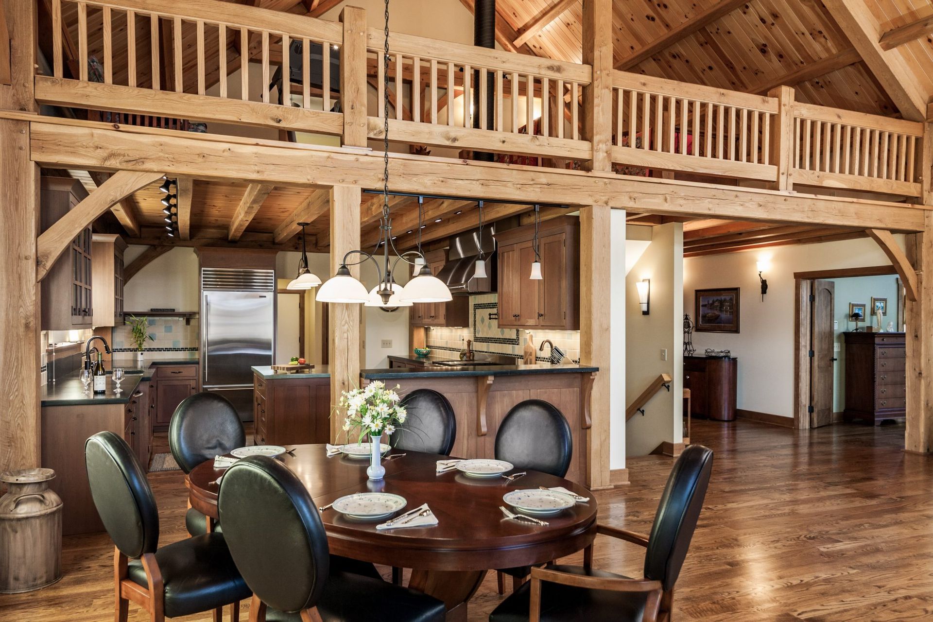A dining room with a table and chairs in it.