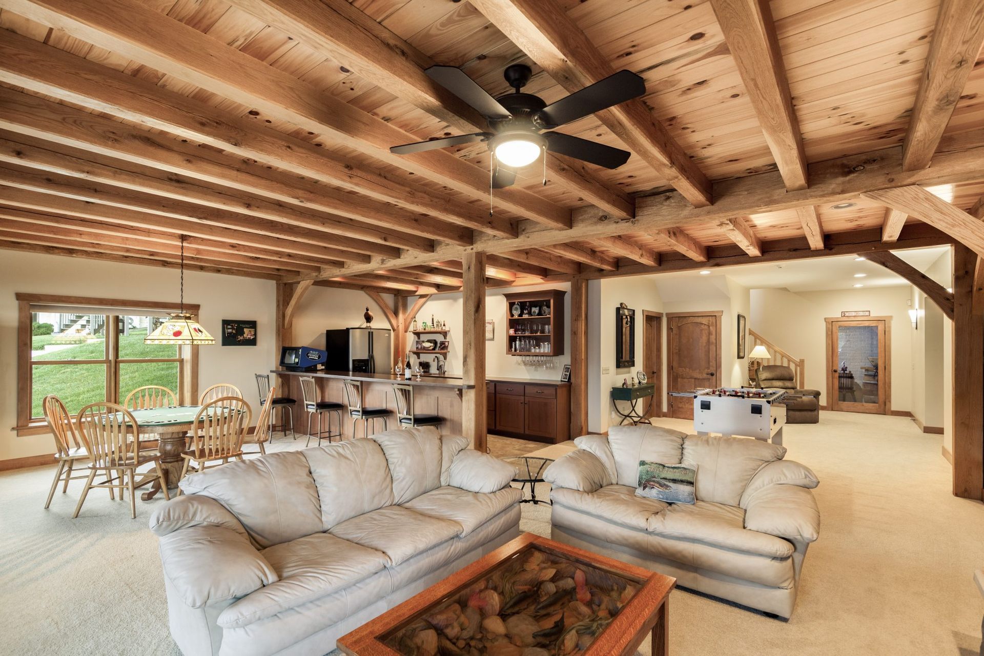 A living room filled with furniture and a ceiling fan