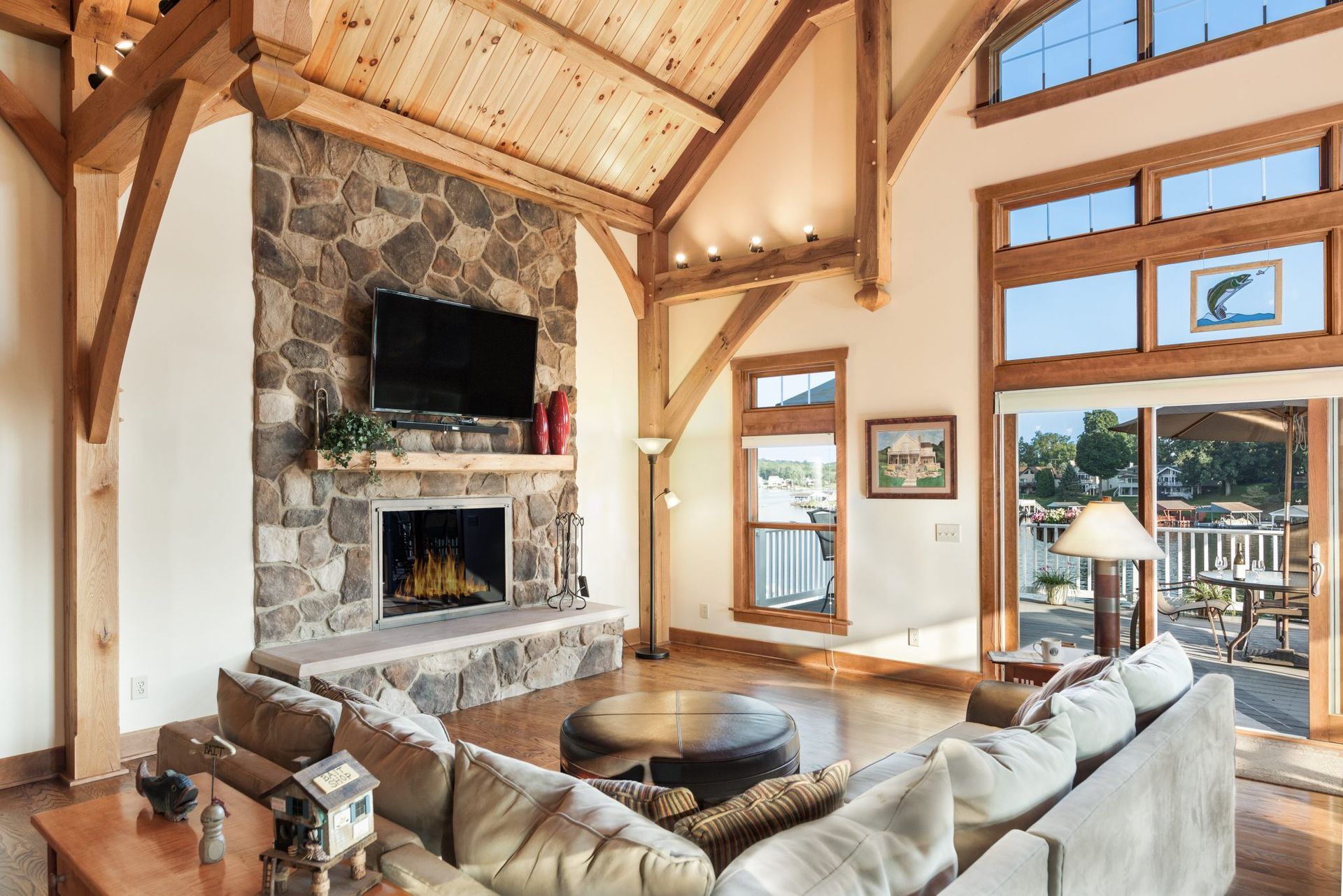 A living room with a fireplace and a flat screen tv.