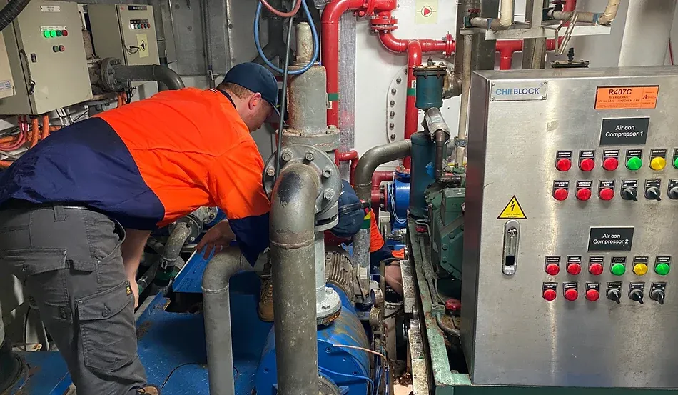 Technician Checking Aircon Compressor — Refrigeration in Berrimah, NT