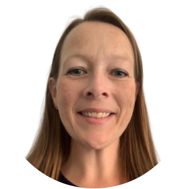 Smiling person with shoulder-length brown hair on a white background