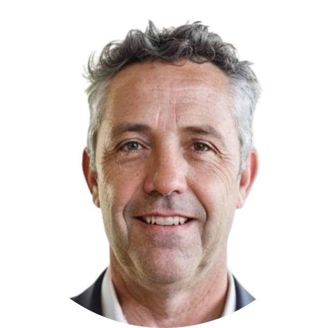 Smiling man with short curly gray hair on a white background
