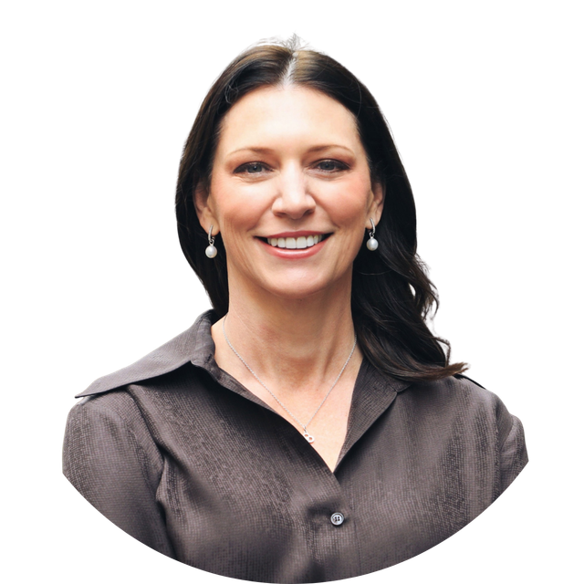 Smiling woman in a dark blouse against a white background