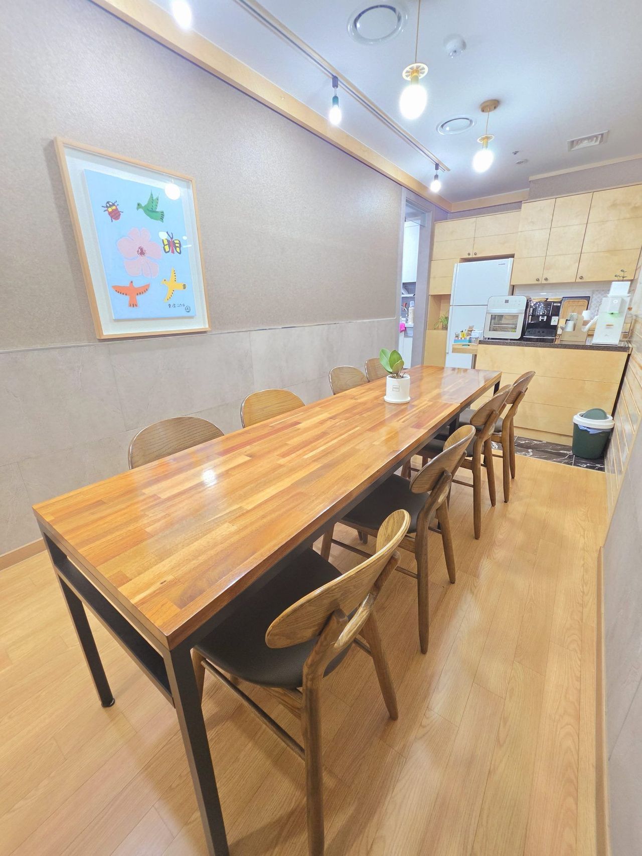 Lounge at Maum Meditation Cheongdam, with a long table and kitchen
