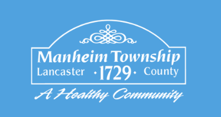 A blue sign that says manheim township lancaster 1729 county a healthy community