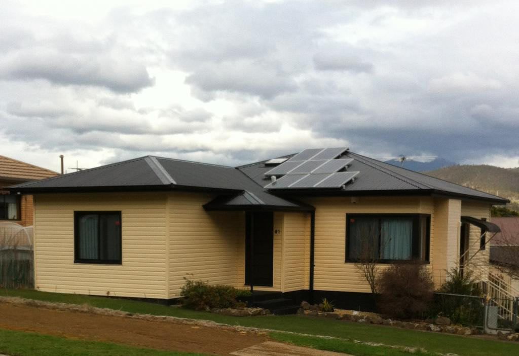 House with Solar Panels on Roof — Hobart, TAS — Building Improvement Specialists