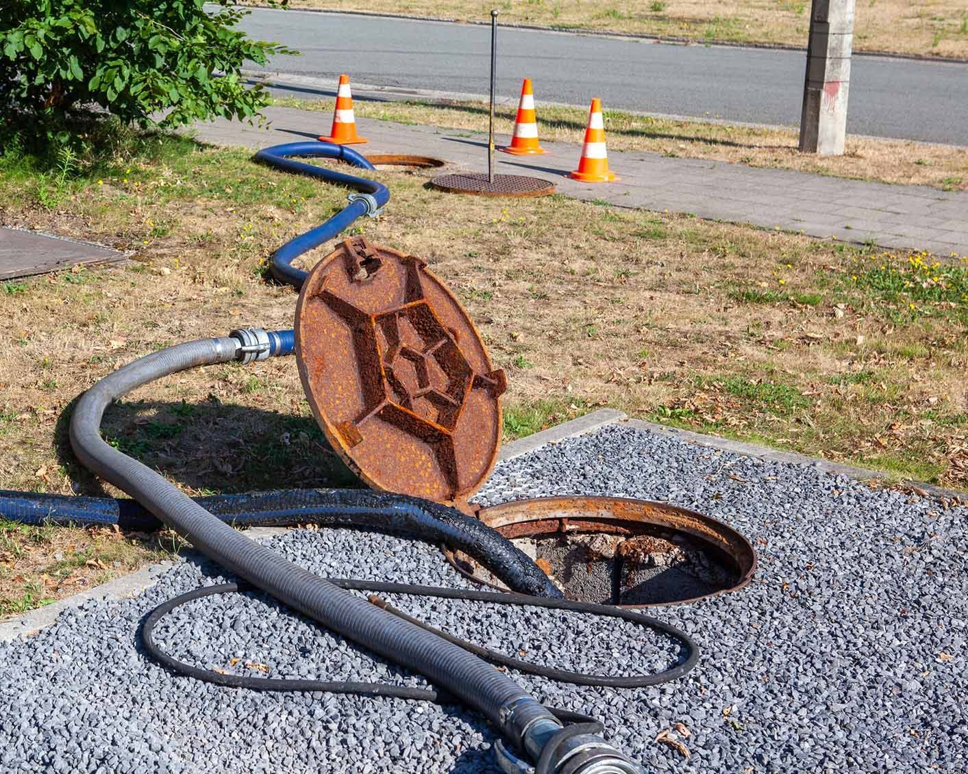 A sewer with a hose attached to it