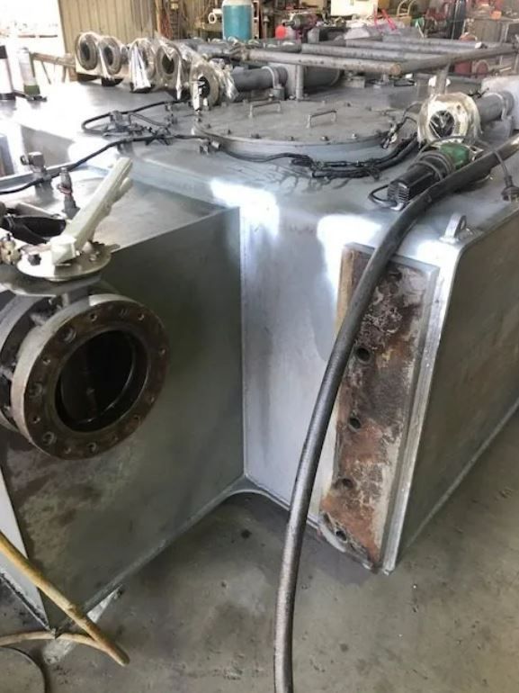 A Large Stainless Steel Tank With A Hose Attached To It — ADR Engineering in Collinsville, QLD