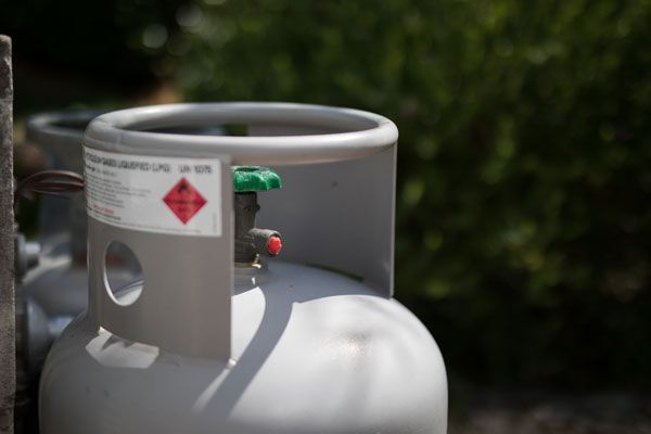 A Close Up Of A Gas Cylinder With A Green Valve — ADR Engineering in Collinsville, QLD
