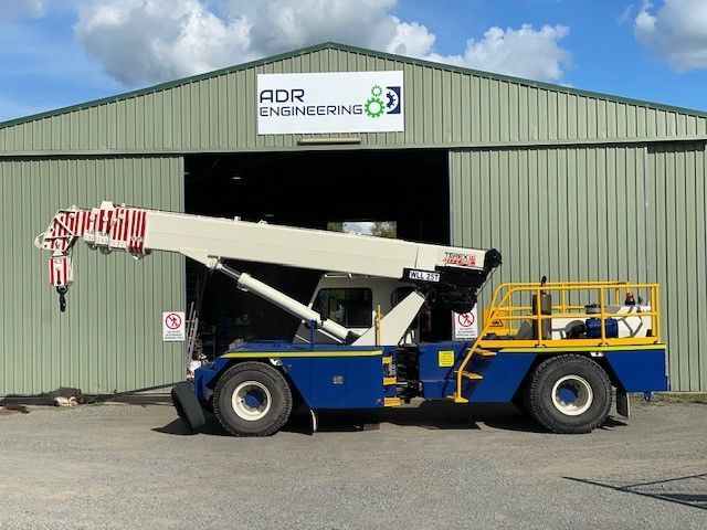 A Crane Is Parked In Front Of An Adr Engineering Building — ADR Engineering in Collinsville, QLD