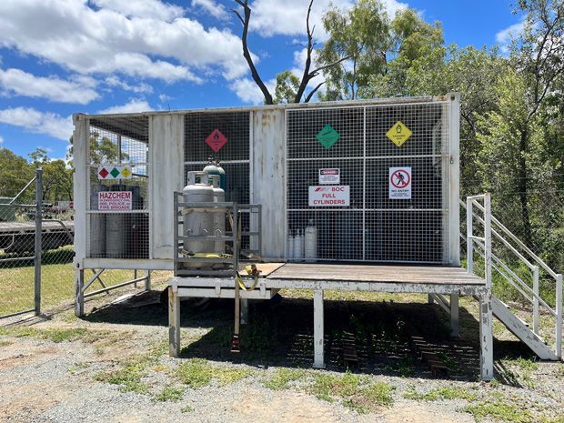 A Small Building With A Cage On Top Of It And Stairs — ADR Engineering in Collinsville, QLD