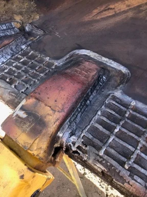 A Piece Of Metal Is Sitting On Top Of A Wooden Table — ADR Engineering in Collinsville, QLD