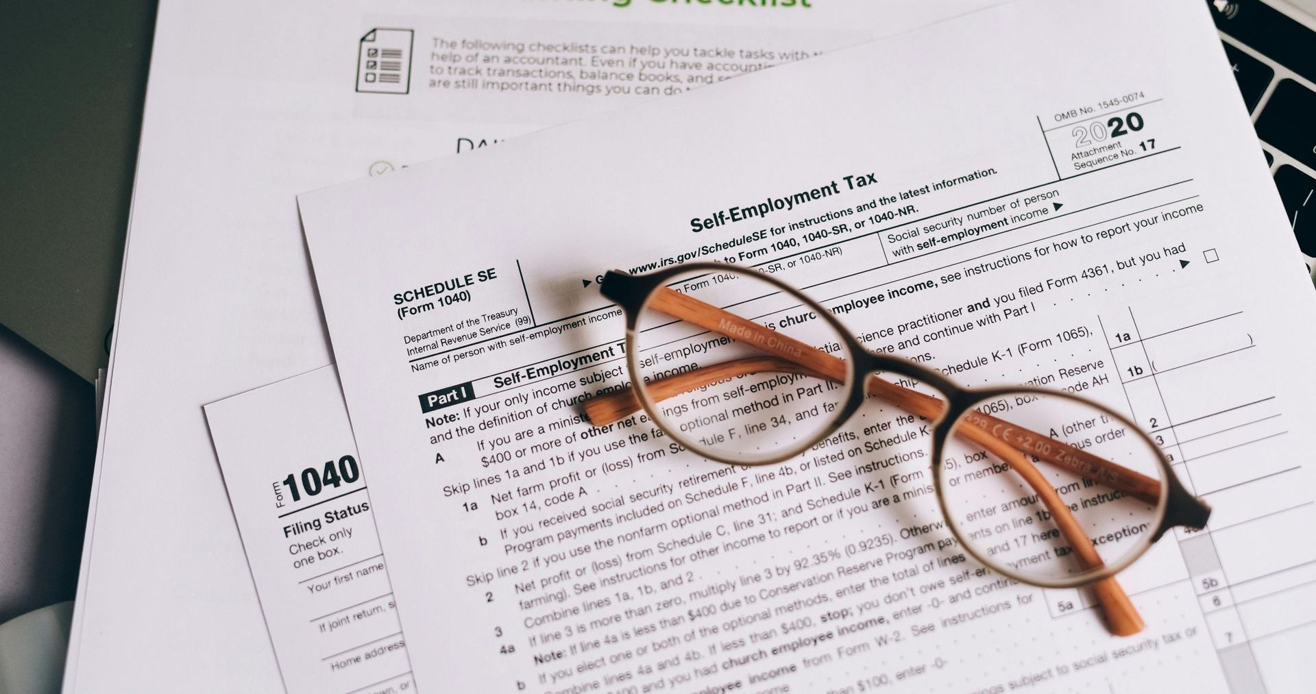 A pair of glasses is sitting on top of a tax form.