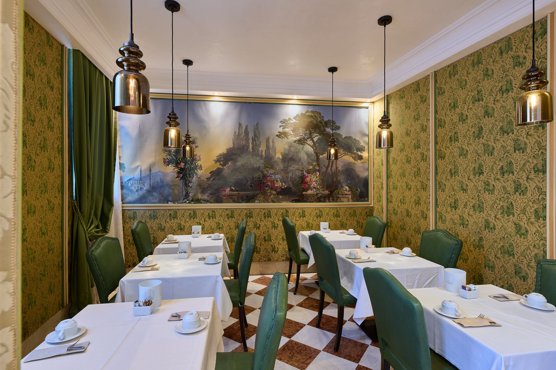 A dining room with tables and chairs and a painting on the wall