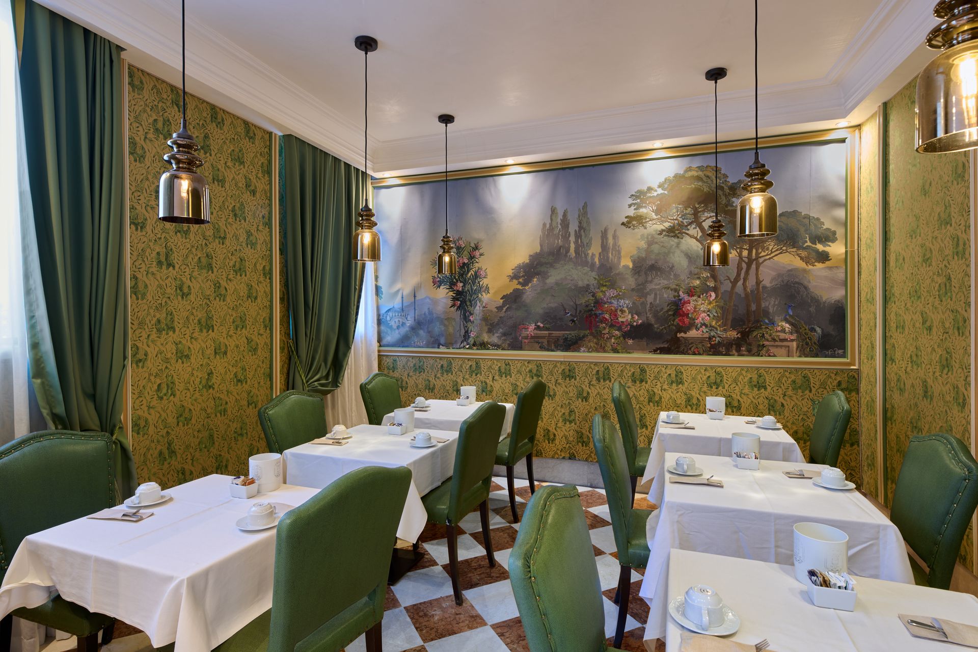 A dining room with tables and chairs and a painting on the wall.