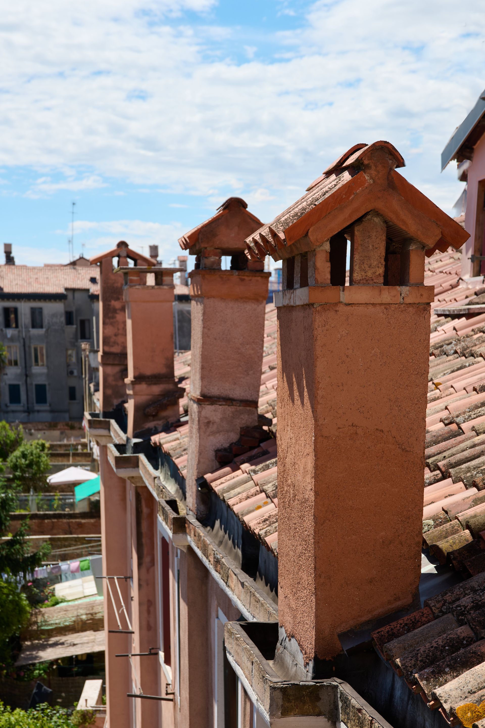 A row of chimneys on the roof of a building