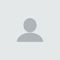 Gray generic user avatar icon on a light background