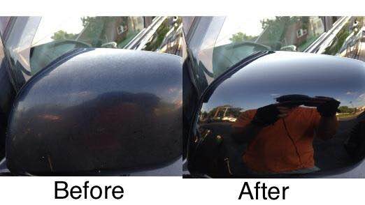 Car side mirror before and after polishing, showing dull black finish versus glossy reflection.