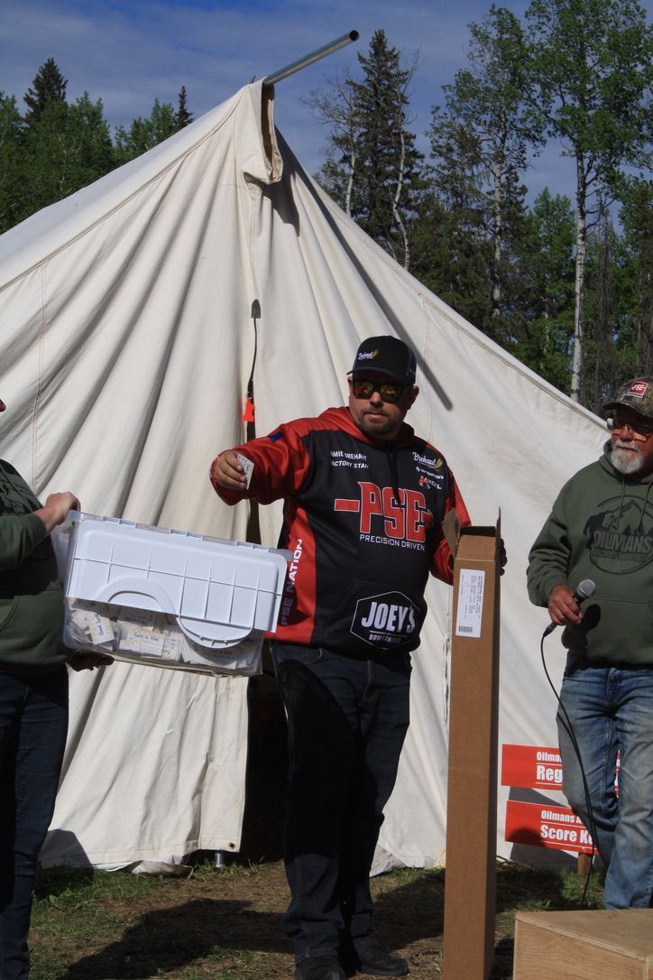 A man handing out prizes.