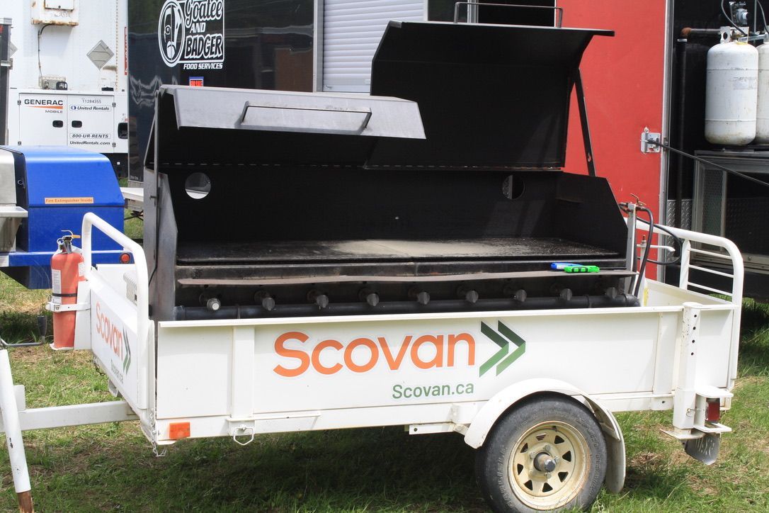 A white trailer with the word scovan on it