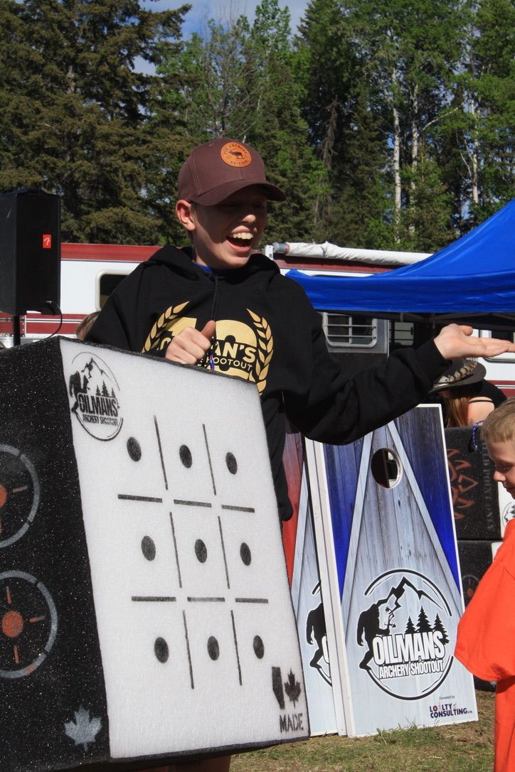 A man holding a tic tac toe board in his hands