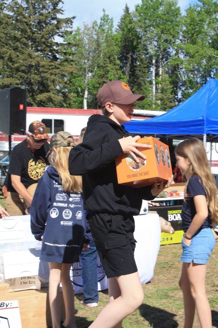 A man is carrying a box that says ' coca cola ' on it
