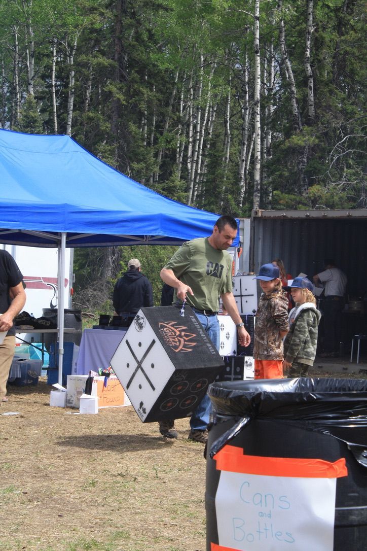 A man is carrying a box with the letter x on it