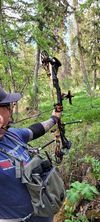 Archer shooting arrow at target