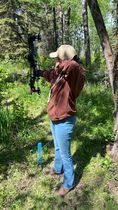 Archer shooting arrow at target