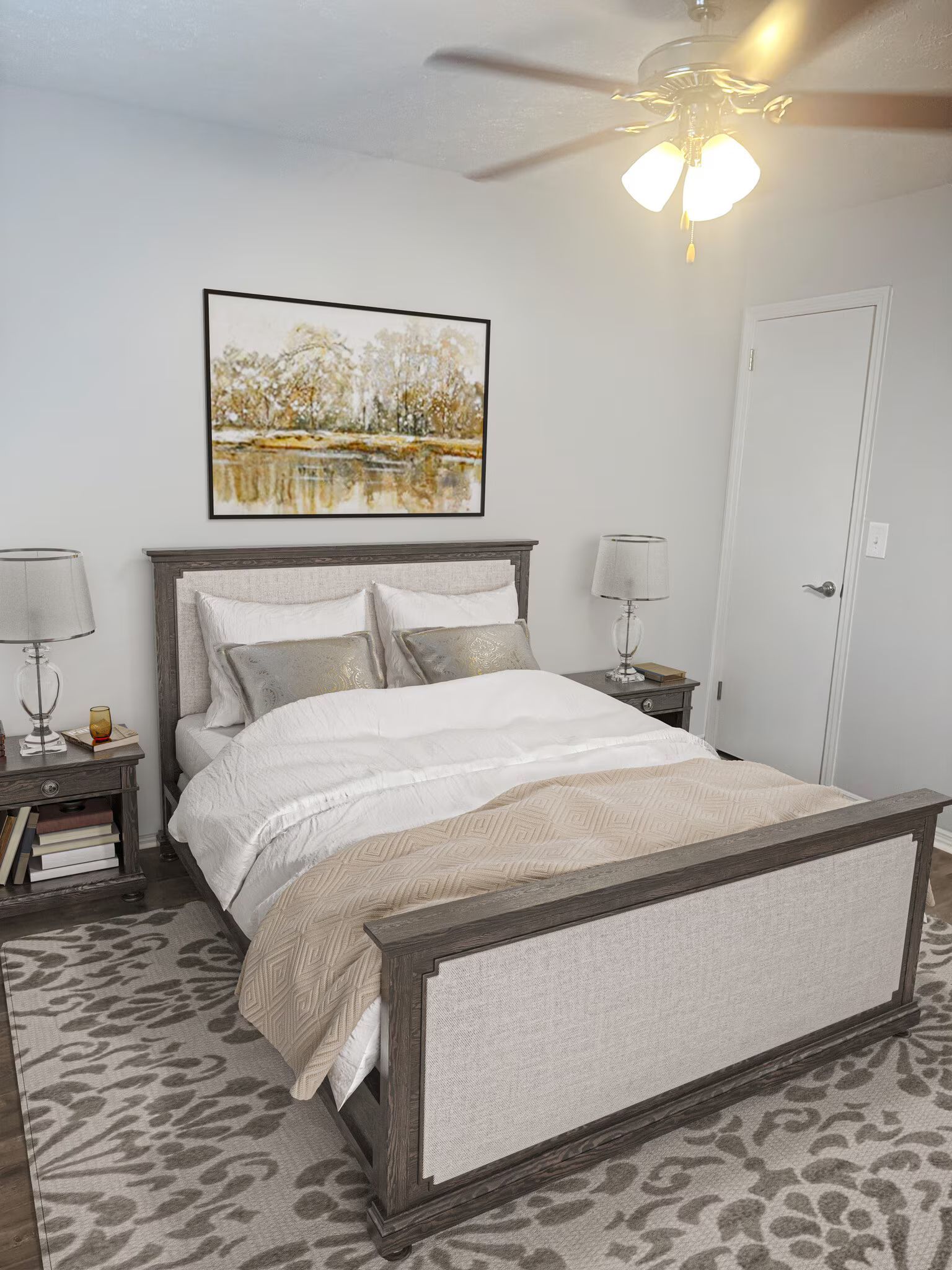 Bedroom with a bed, nightstands, artwork, and a ceiling fan.