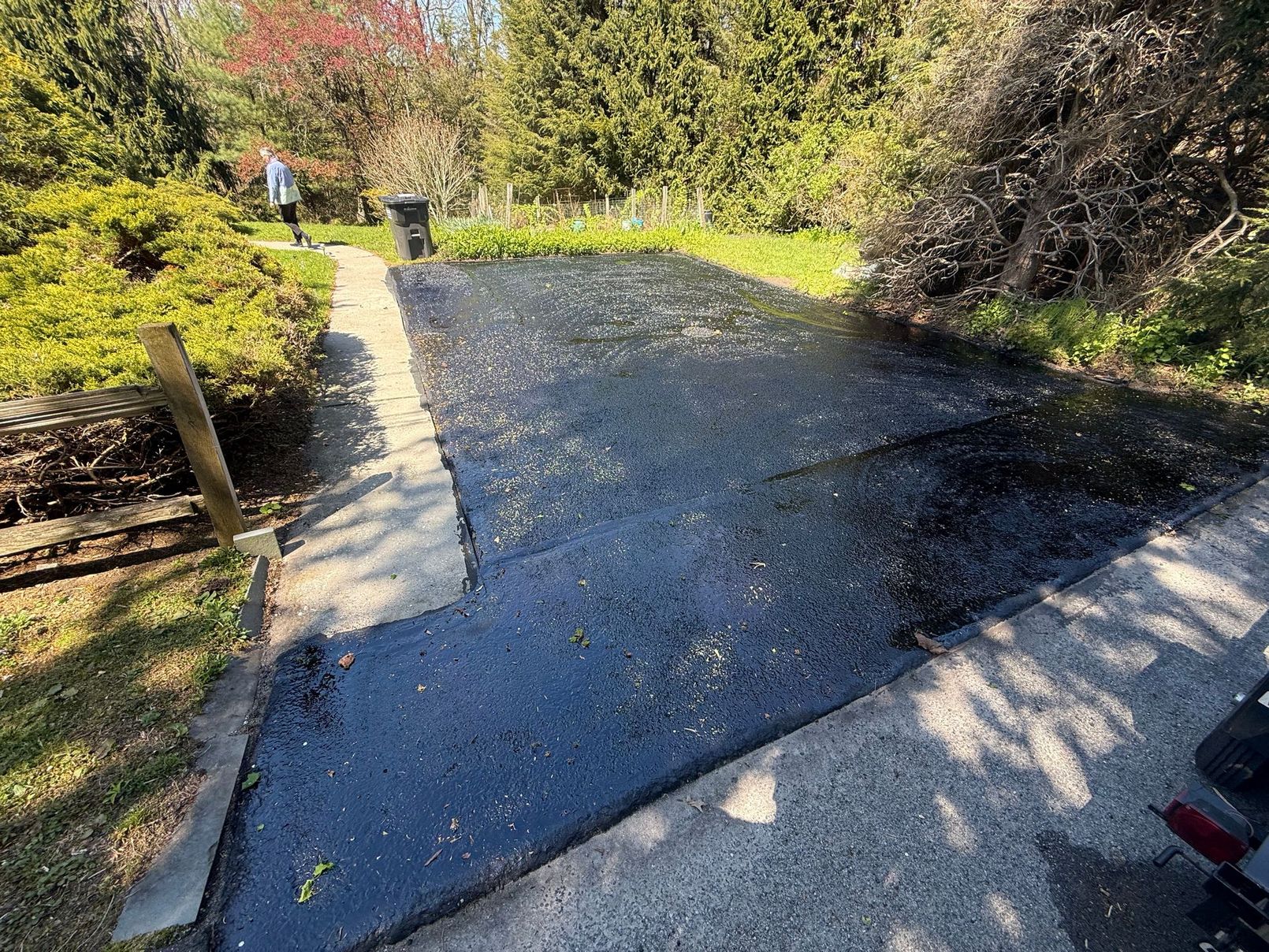 Before and after driveway sealcoating project