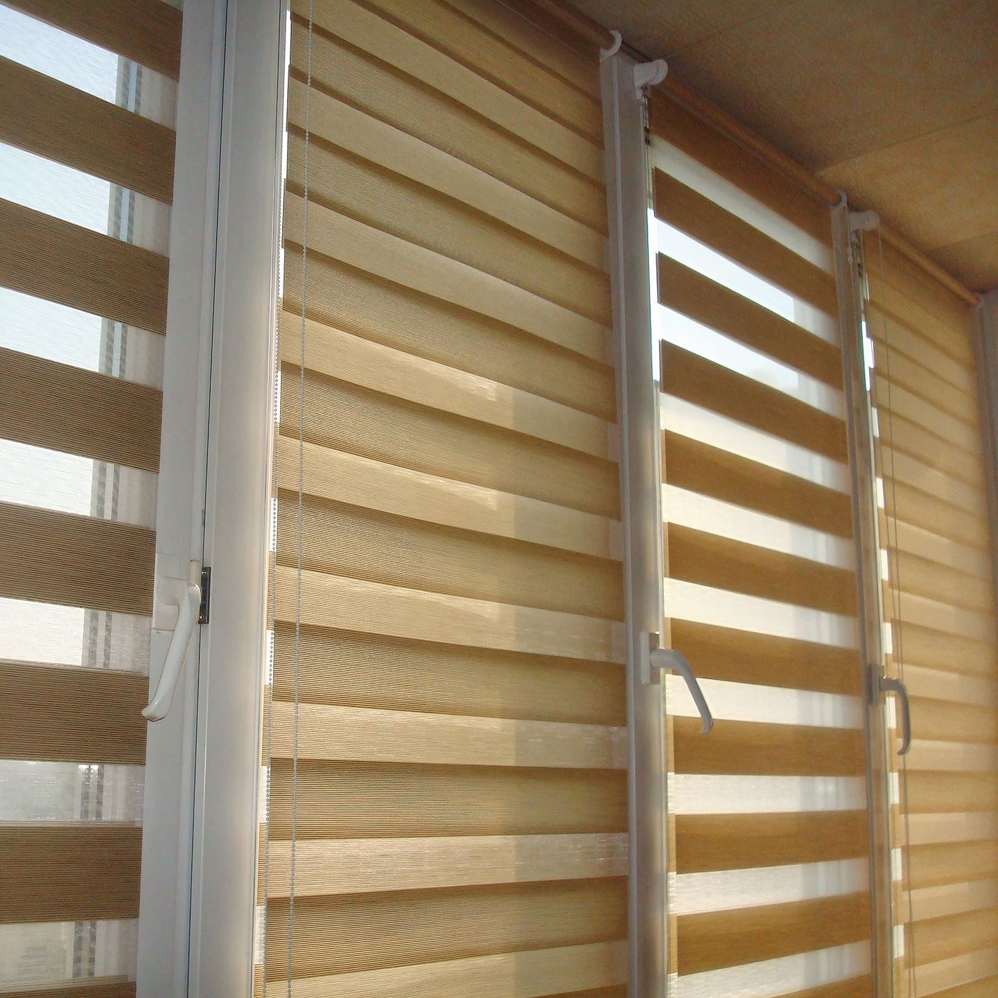 A close up of a window with blinds on it