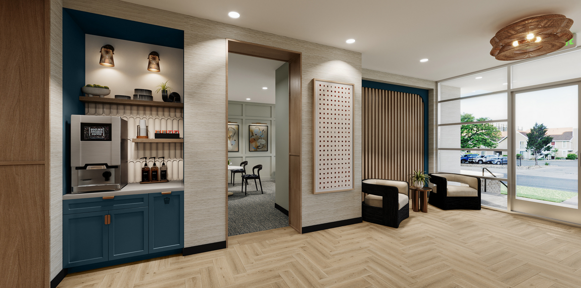 Interior of a waiting room with a coffee station, seating, and large windows.