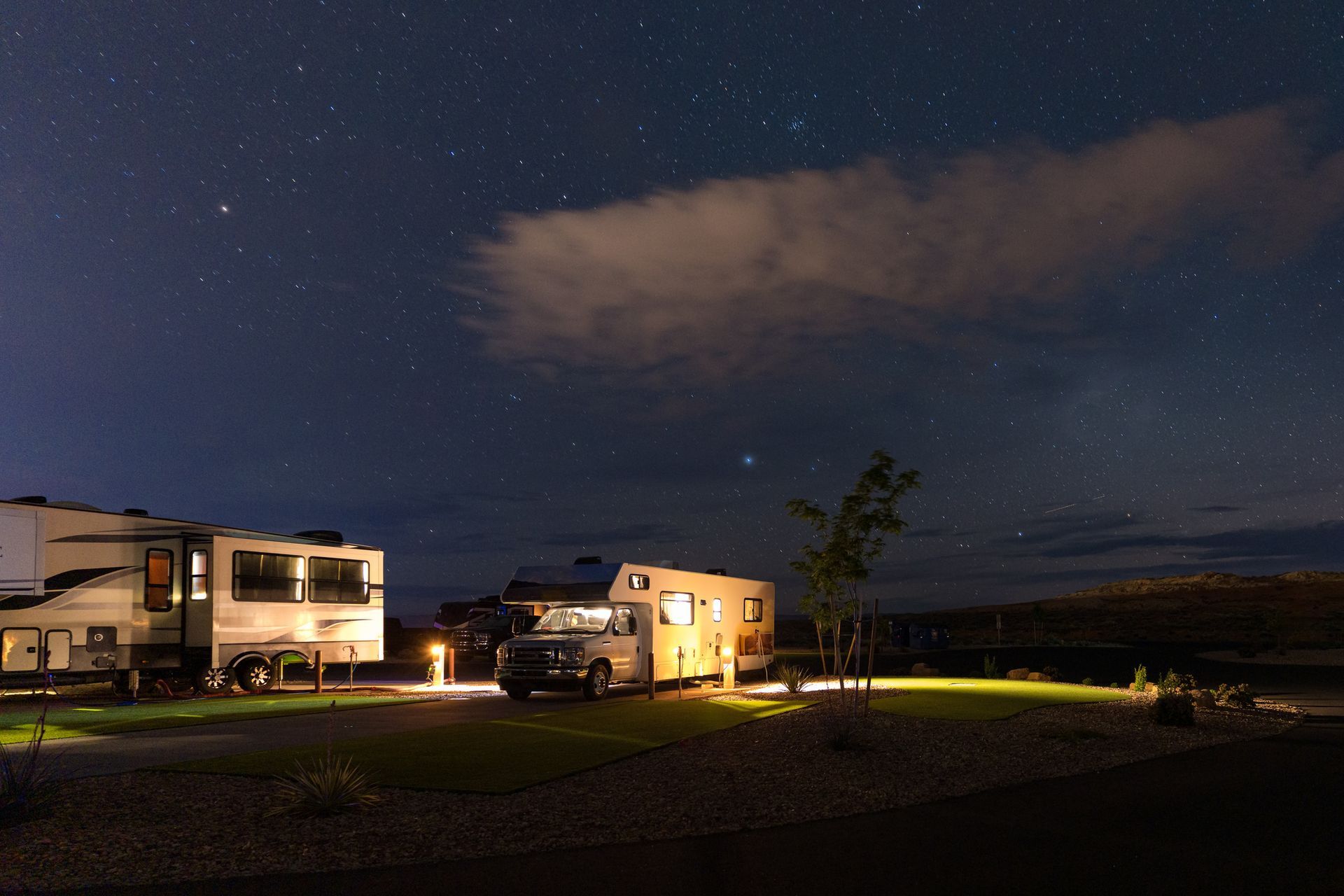 Caravan park visitors enjoying the starry night sky at a popular holiday park.