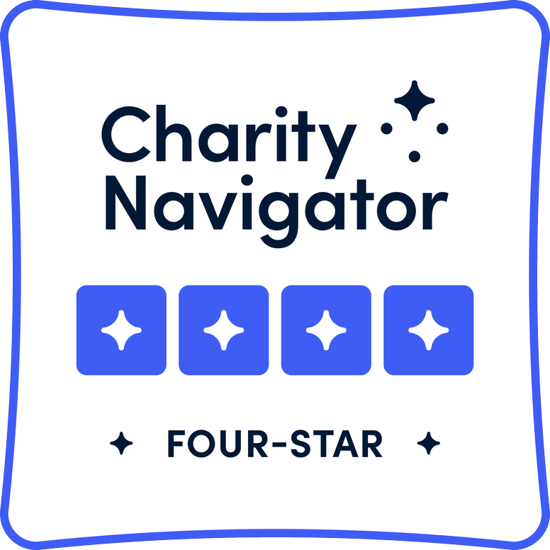 Charity Navigator Four-Star rating badge with text and four blue squares with stars on a white background, outlined in blue.
