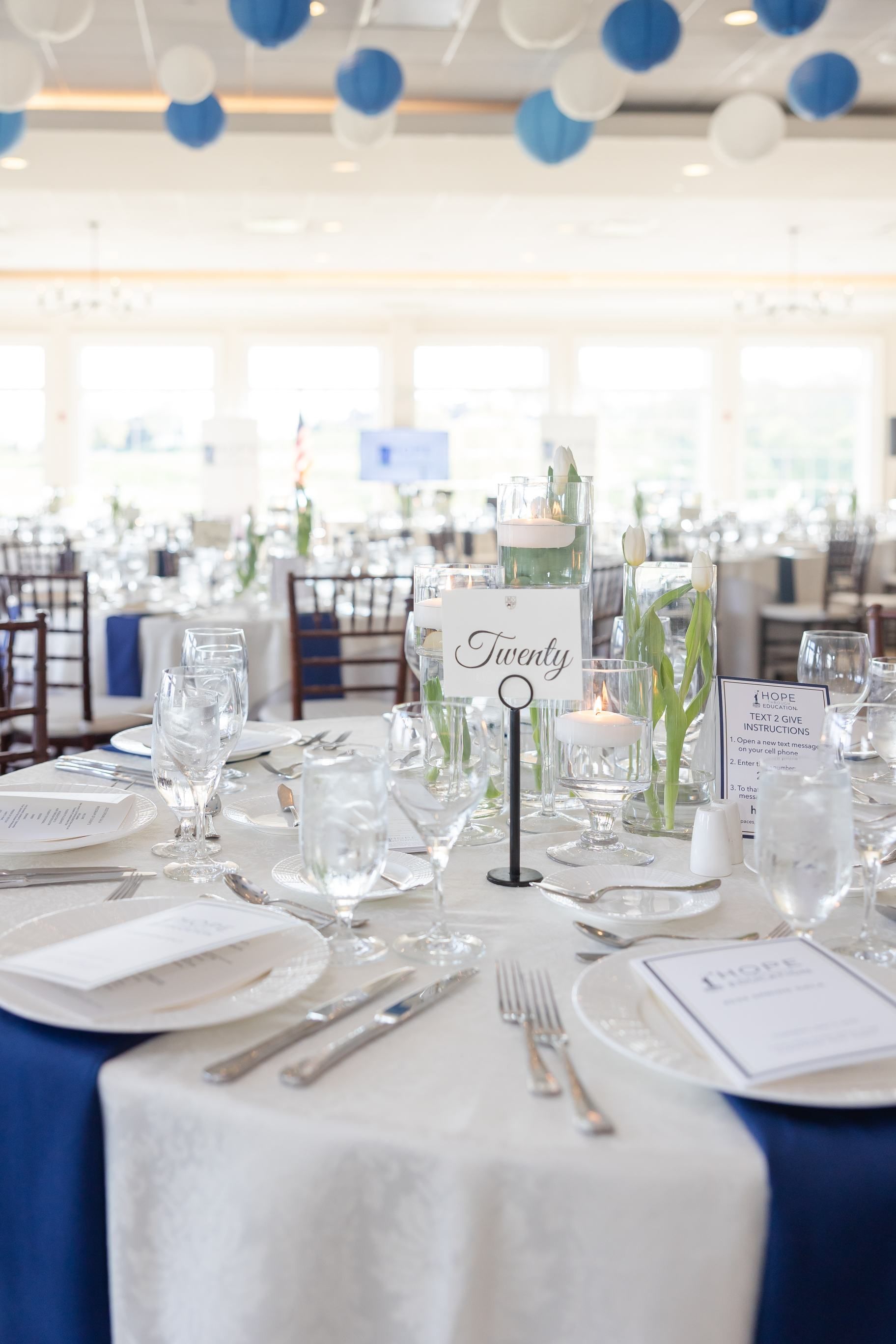 Formal event table setting, blue and white decor. Table number 