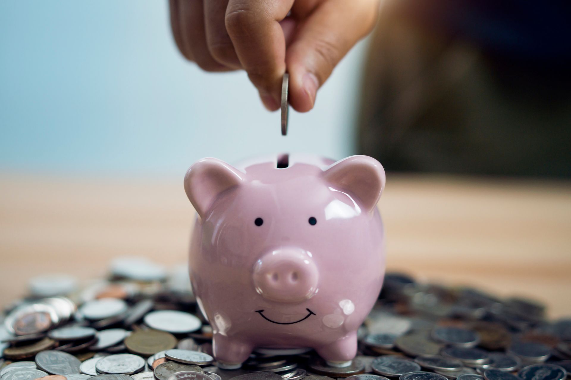 Saving money in piggy bank
