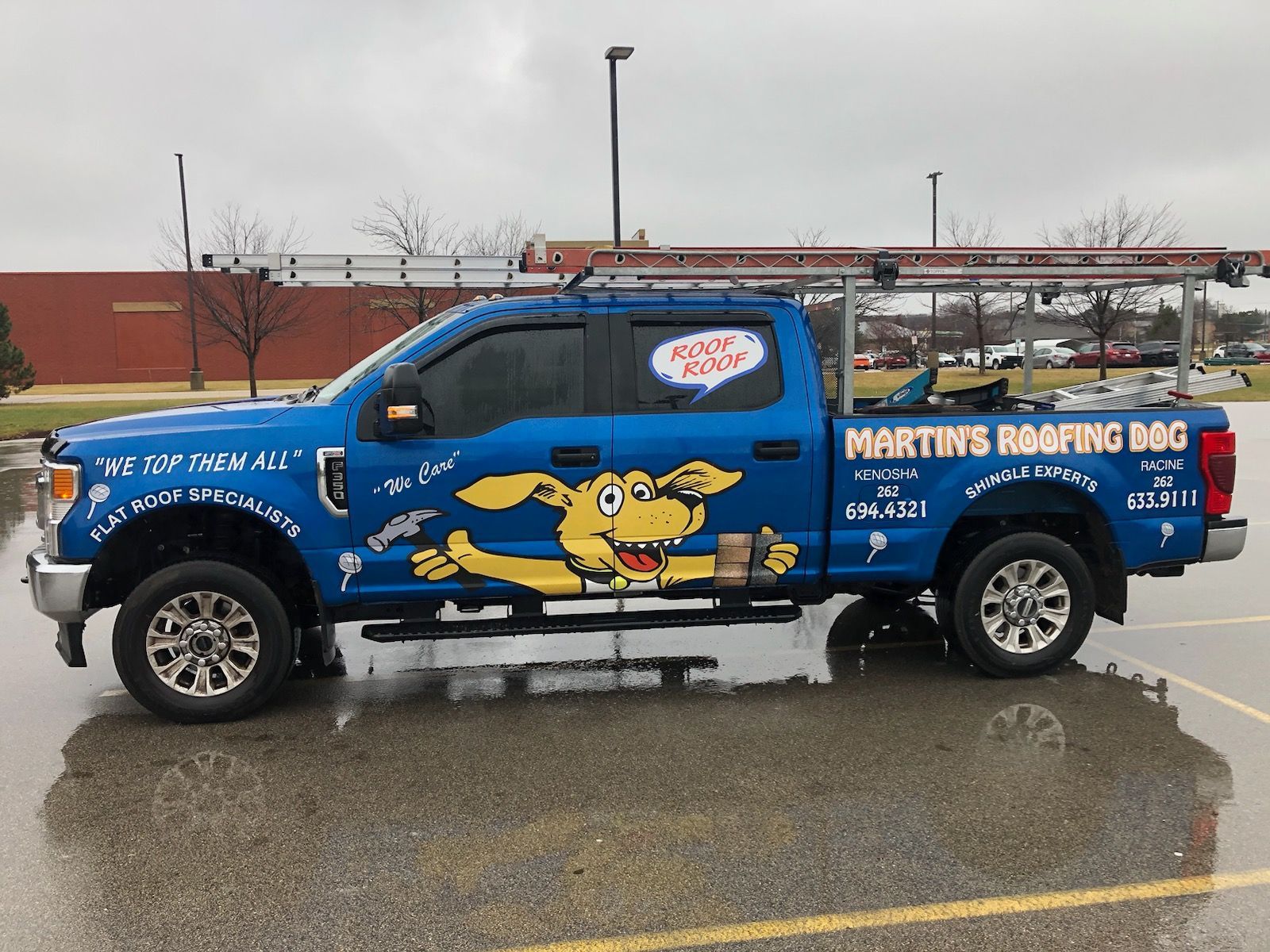 A Man Is Working on The Roof of A House - Kenosha, WI - Martin's Roofing Dog Inc.