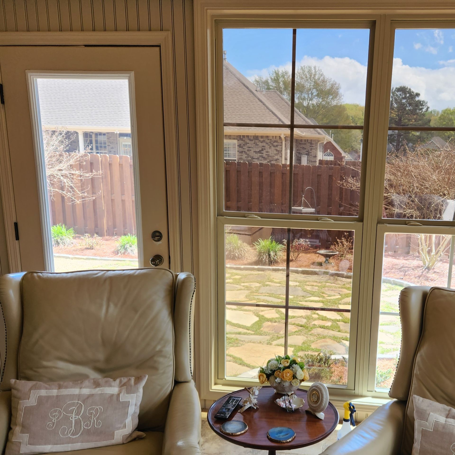 home window tinting Prattville AL - Contrasting Sun Glare seen before last window and glass door are treated with SPF Tint in Prattville AL